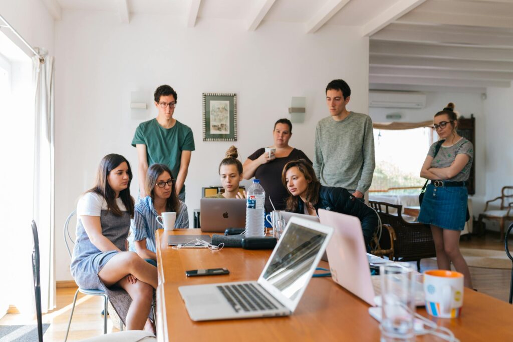 people in a dorm room creating a functional study space.